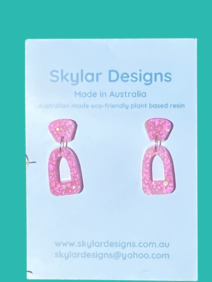 close up of pink colour resin glitter dangle earrings