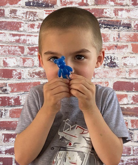 boy holding a eco-friendly resin bear hug