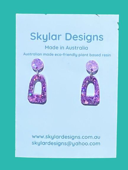 close up of purple colour resin glitter dangle earrings