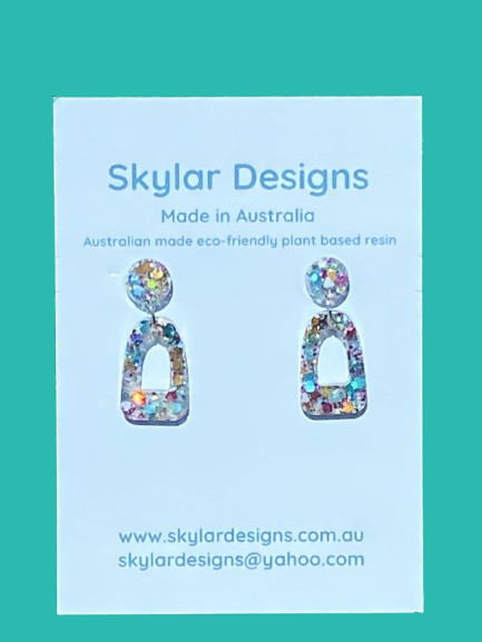close up of rainbow colour resin glitter dangle earrings